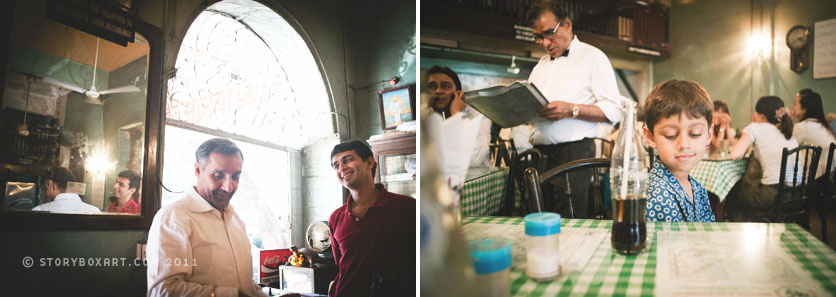 men talking at cafe and boy drinking soda