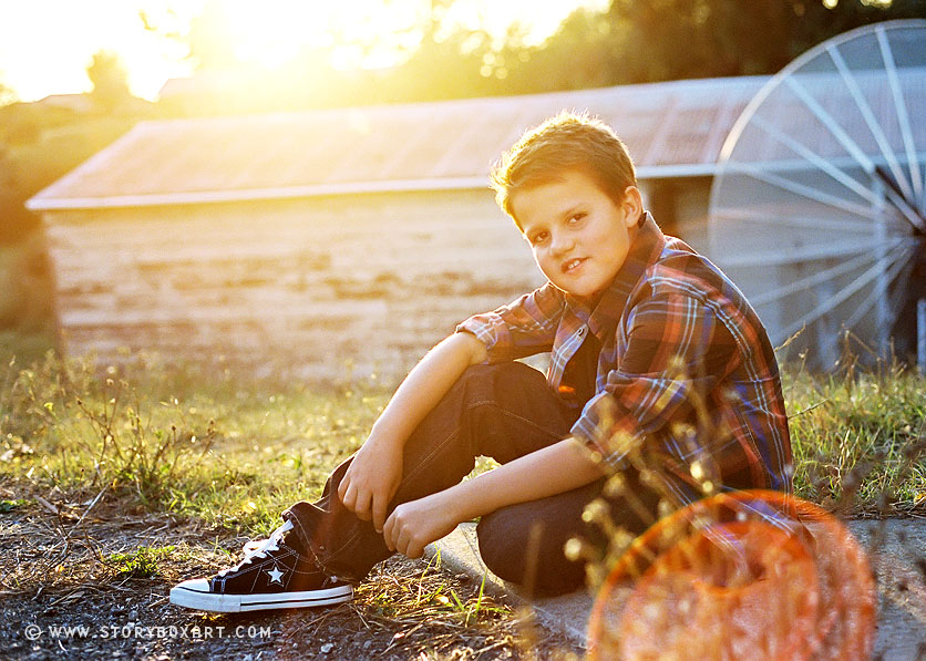 Portraits at sunset of young boy